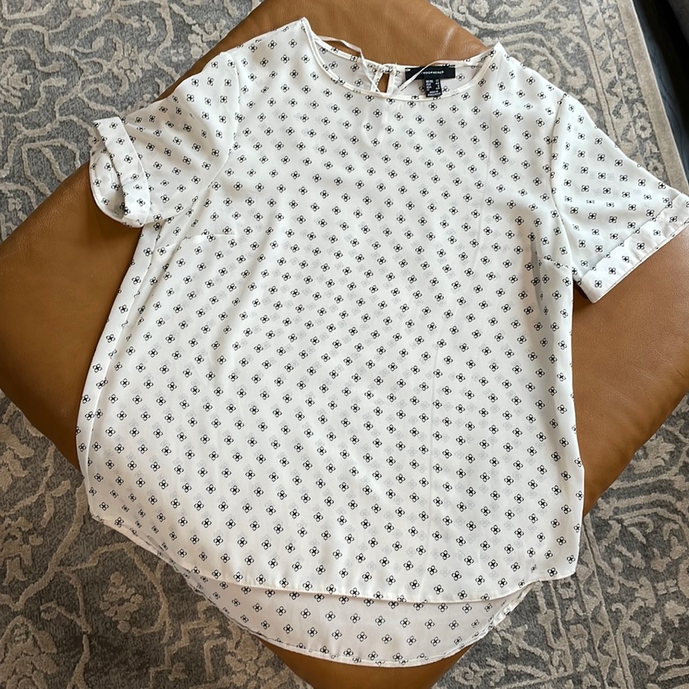 White blouse with black pattern